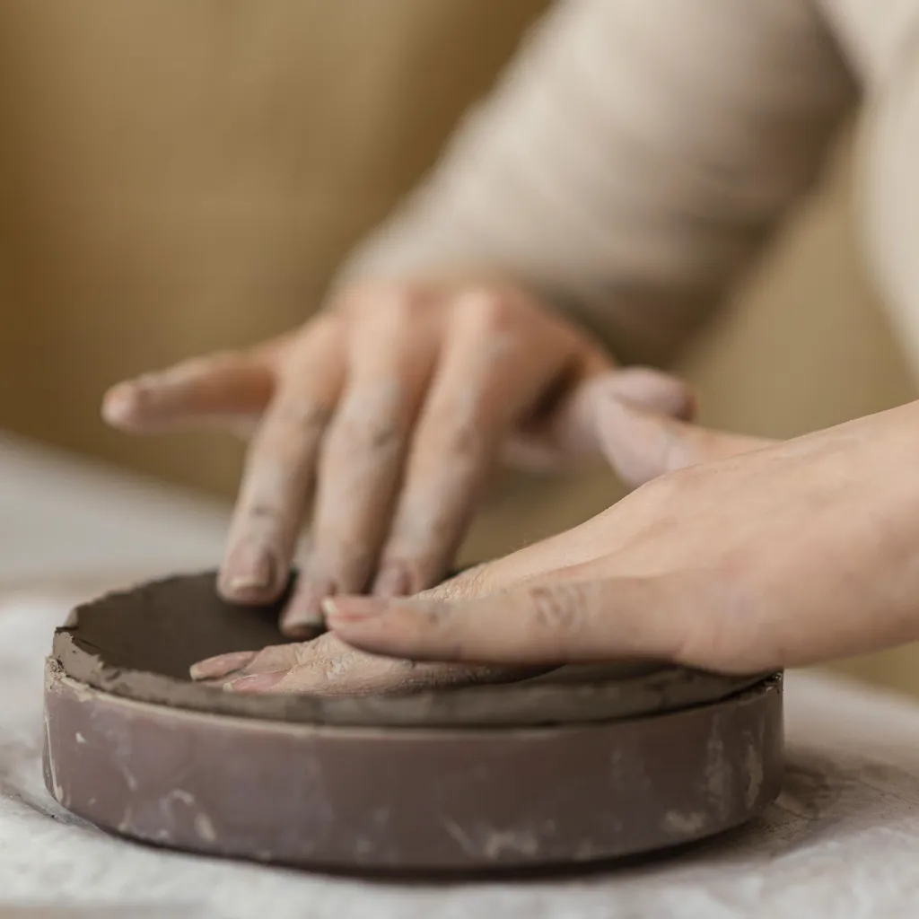 close-up-hands-touching-clay.webp