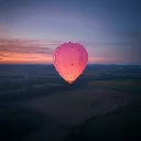 hot-air-balloon-soaring-fields-sunset.webp